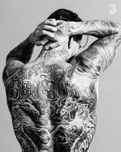 Black-and-white view of Maluma's tattooed back