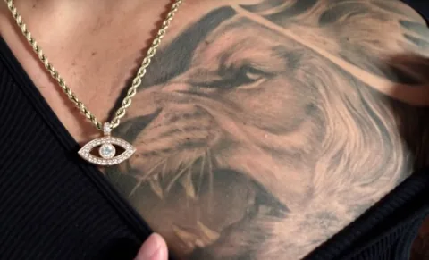 Close-up of a lion tattoo on Maluma's chest